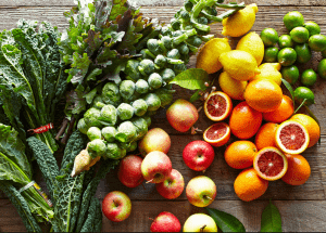 a group of fruits and vegetables on a wood surface Healthy Weight Loss Diets Llanelli